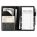 Mymazn Black Classic Server Book open with a guest check, cash, reference cards, and an exterior pen holder